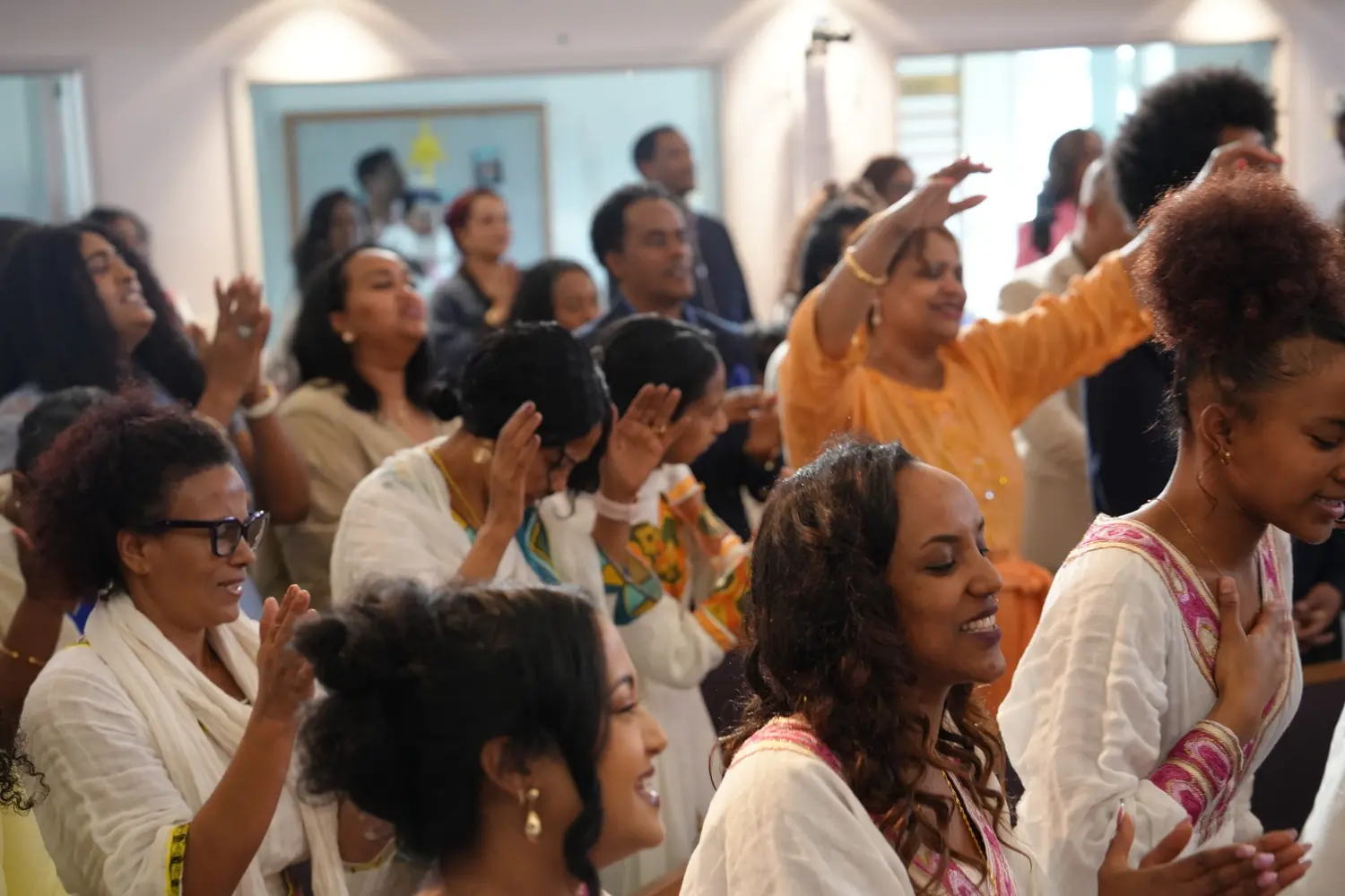 The congregation worshiping together with joy
