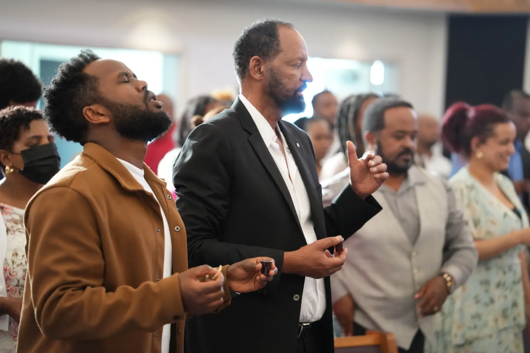 Congregation worshiping during Sunday service
